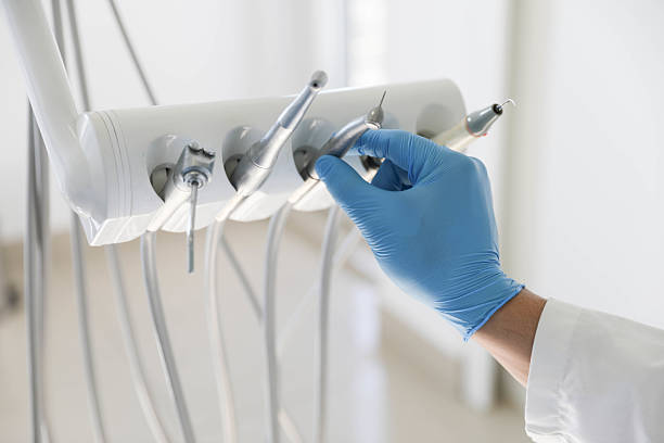 Professional Tooth Extraction technician working in Joliet, IL